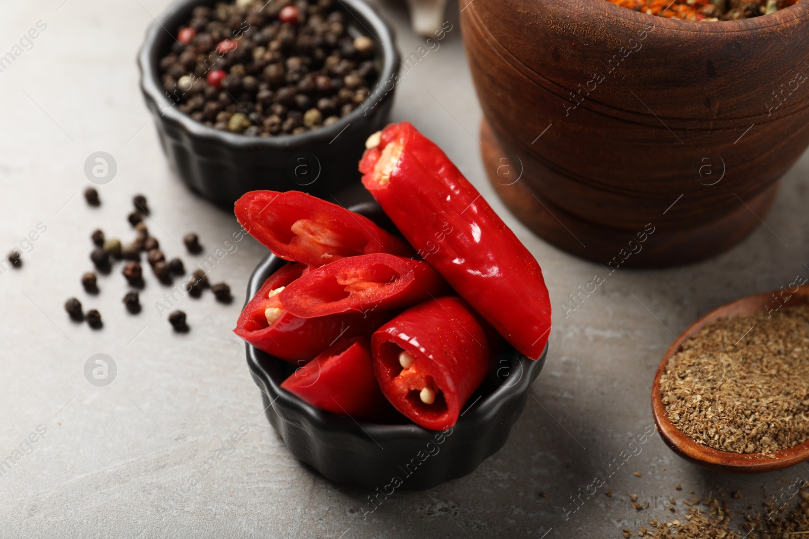 Different aromatic spices on gray textured table, closeup Photo of Different aromatic spices on gray textured table, closeup