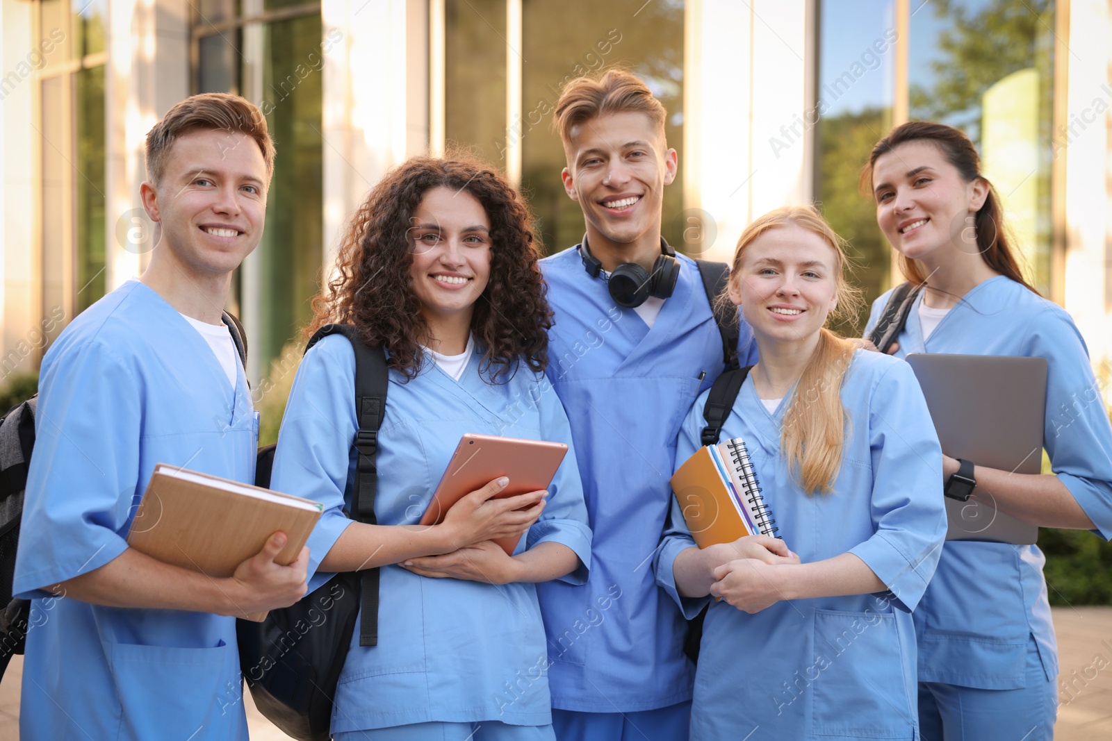 Group of medical students in uniforms near building outdoors Photo of Group of medical students in uniforms near building outdoors