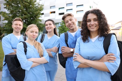Photo of Group of medical students with backpacks outdoors