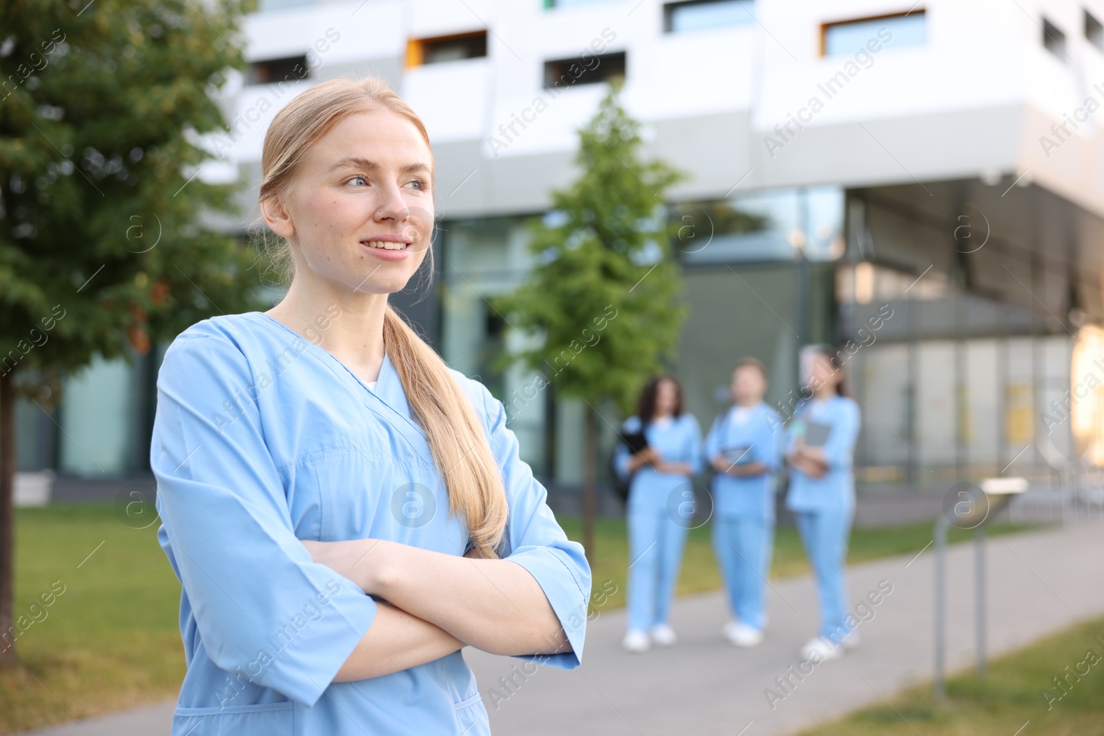 Photo of Medical student in uniform outdoors, selective focus