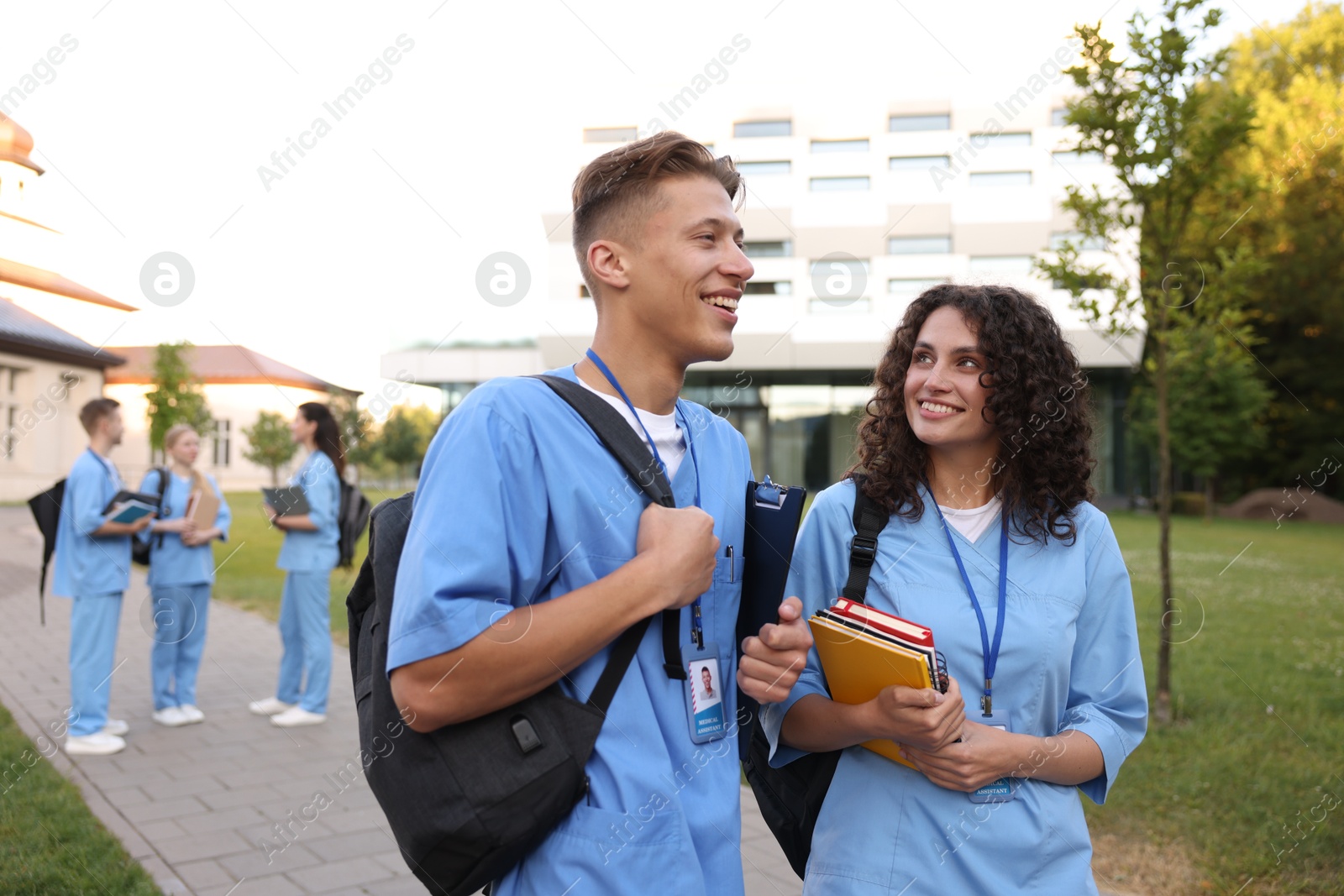Medical students in uniforms outdoors, selective focus Photo of Medical students in uniforms outdoors, selective focus