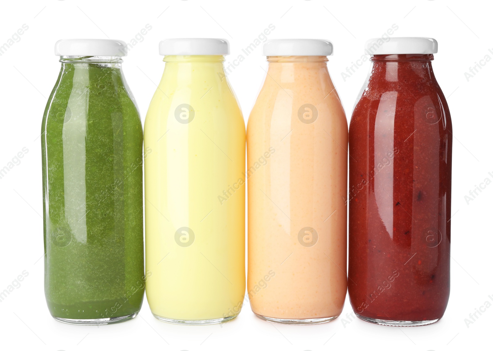 Superfood. Different tasty smoothies in glass bottles isolated on white Photo of Superfood. Different tasty smoothies in glass bottles isolated on white
