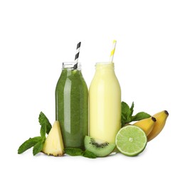 Photo of Superfood. Tasty smoothies in glass bottles and ingredients isolated on white