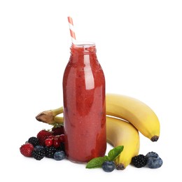 Photo of Superfood. Tasty smoothie in glass bottle and ingredients isolated on white