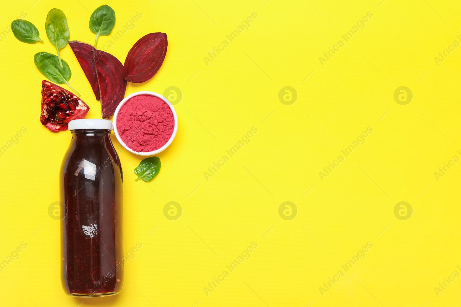 Superfood. Tasty smoothie in glass bottle and ingredients on yellow background, flat lay. Space for text Photo of Superfood. Tasty smoothie in glass bottle and ingredients on yellow background, flat lay. Space for text