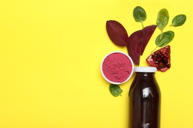 Photo of Superfood. Tasty smoothie in glass bottle and ingredients on yellow background, flat lay. Space for text