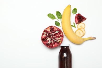 Photo of Superfood. Tasty smoothie in glass bottle and ingredients on white background, top view. Space for text