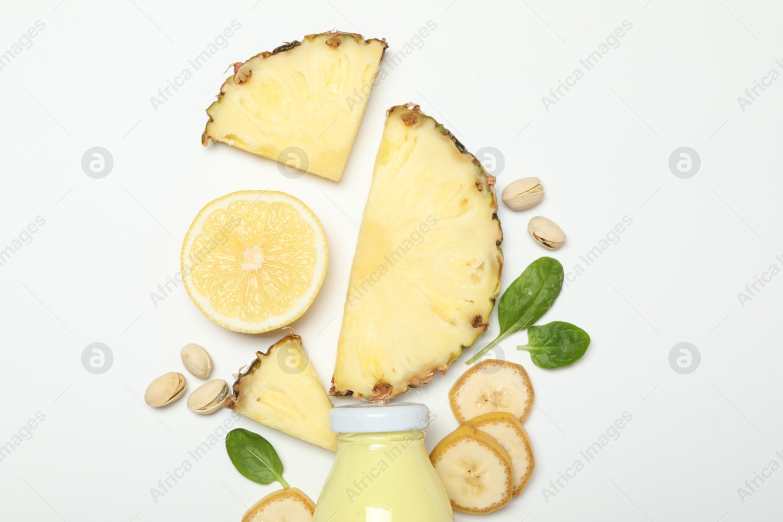 Photo of Superfood. Tasty smoothie in glass bottle and ingredients on white background, top view
