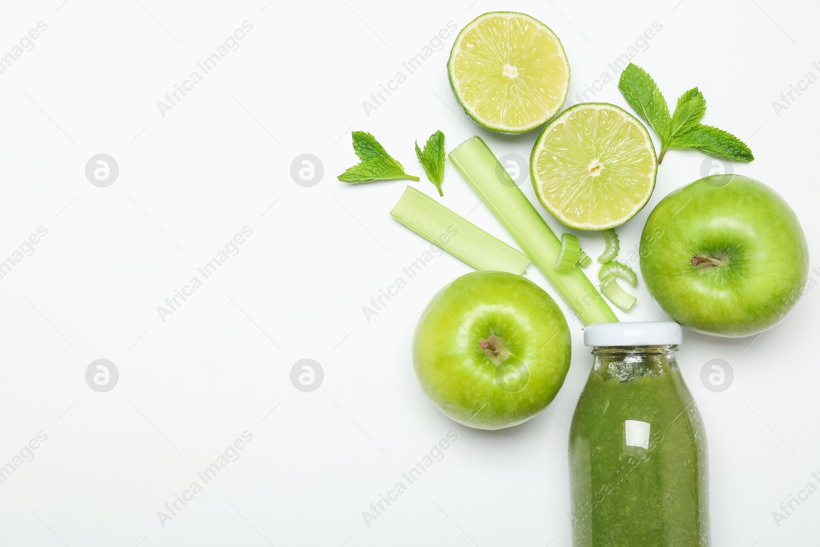 Superfood. Tasty smoothie in glass bottle and ingredients on white background, top view. Space for text Photo of Superfood. Tasty smoothie in glass bottle and ingredients on white background, top view. Space for text