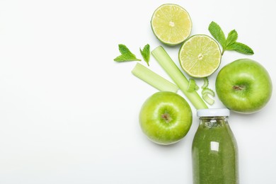Photo of Superfood. Tasty smoothie in glass bottle and ingredients on white background, top view. Space for text