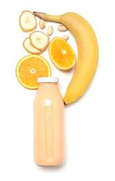 Photo of Superfood. Tasty smoothie in glass bottle and ingredients isolated on white, top view