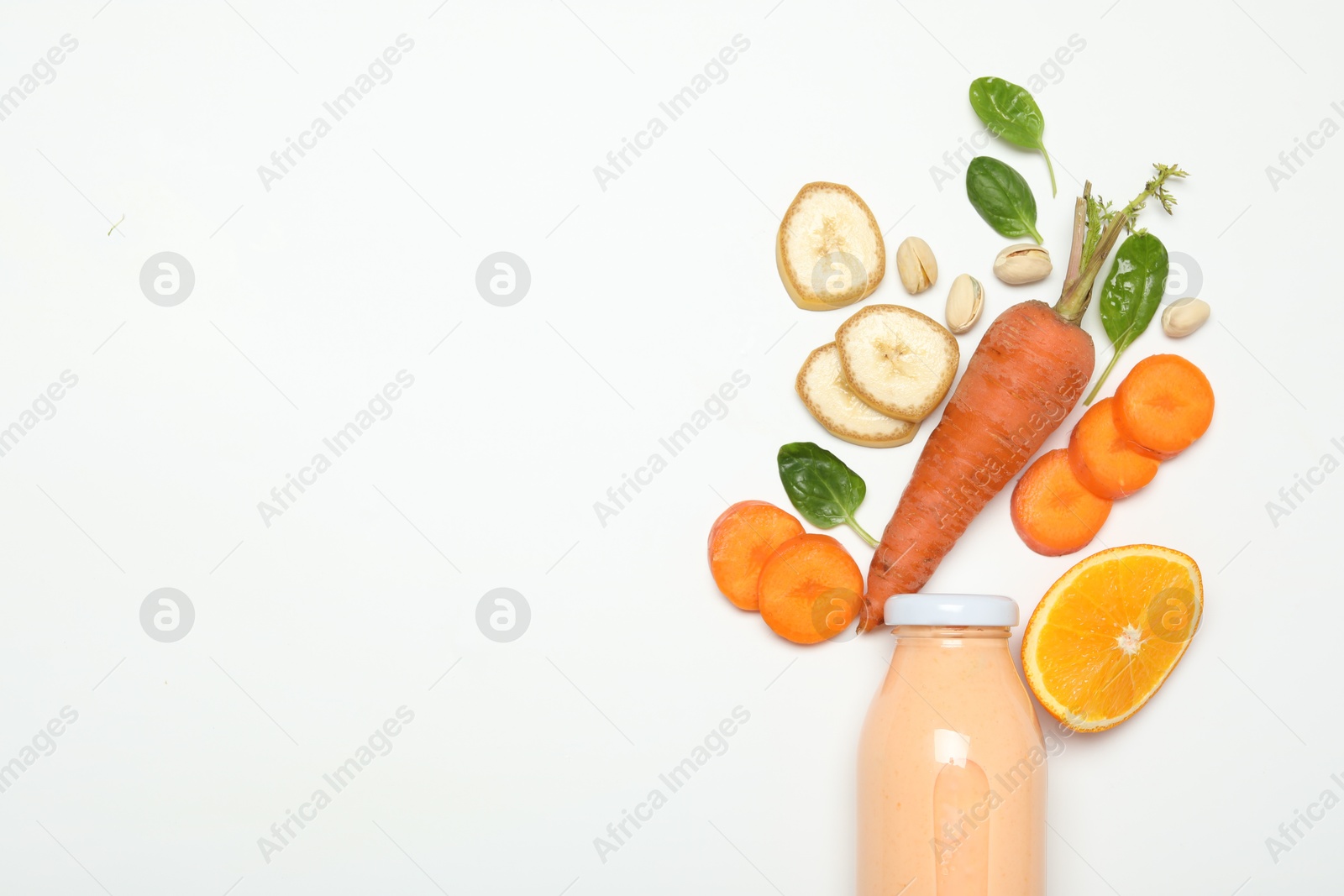Superfood. Tasty smoothie in glass bottle and ingredients on white background, top view. Space for text Photo of Superfood. Tasty smoothie in glass bottle and ingredients on white background, top view. Space for text