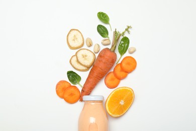 Photo of Superfood. Tasty smoothie in glass bottle and ingredients on white background, top view
