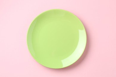 Photo of Stylish plate on pink background, top view