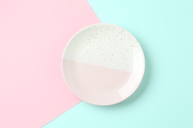 Photo of Stylish plate on color background, top view