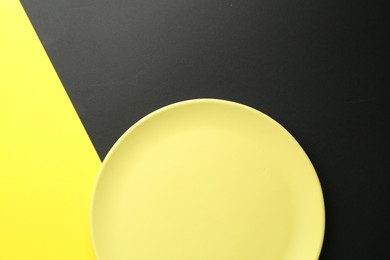 Photo of One stylish plate on color background, top view
