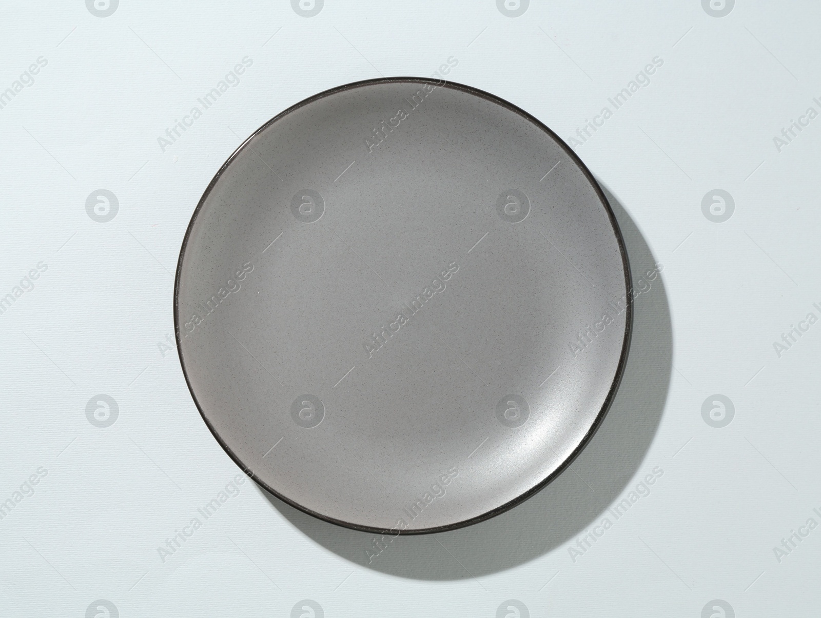 One stylish plate on white background, top view Photo of One stylish plate on white background, top view