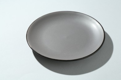 Photo of One stylish plate on white background, closeup