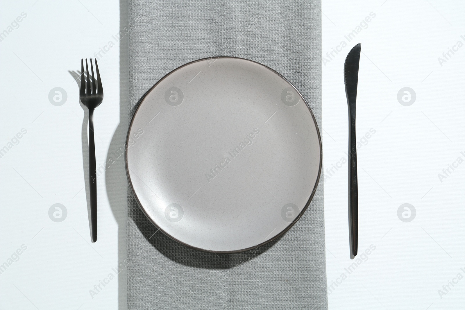 Stylish plate, cutlery and runner on white background, flat lay Photo of Stylish plate, cutlery and runner on white background, flat lay