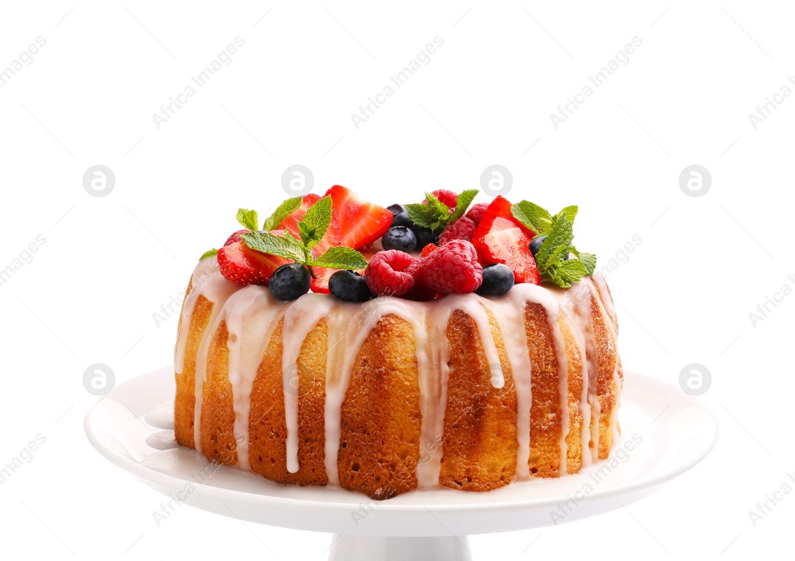 Delicious bundt cake with berries, glaze and mint isolated on white Photo of Delicious bundt cake with berries, glaze and mint isolated on white