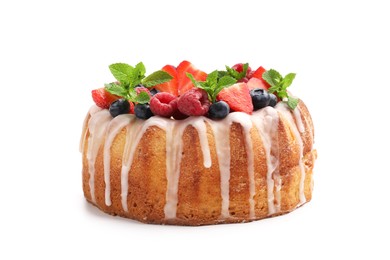 Photo of Delicious bundt cake with berries, glaze and mint isolated on white