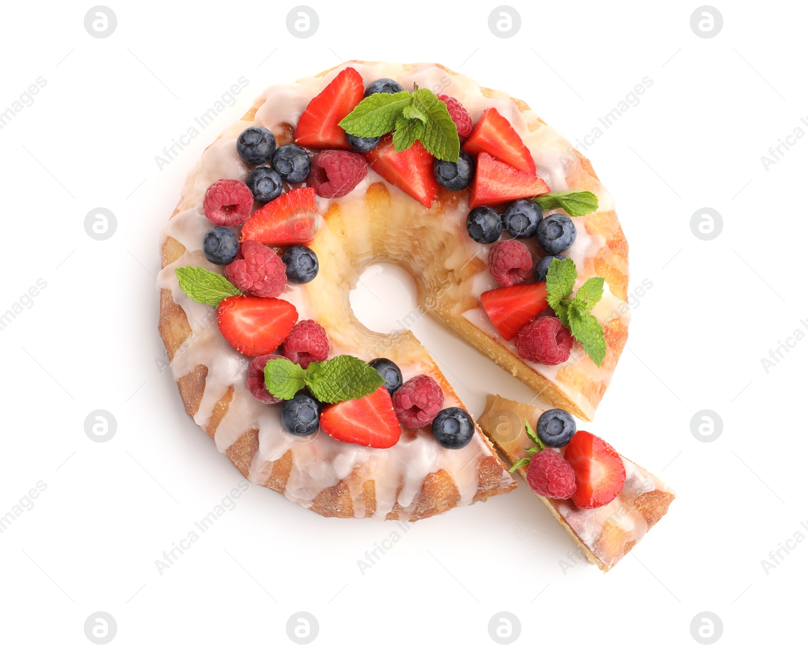 Delicious bundt cake with berries, glaze and mint isolated on white, top view Photo of Delicious bundt cake with berries, glaze and mint isolated on white, top view
