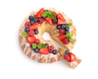 Photo of Delicious bundt cake with berries, glaze and mint isolated on white, top view