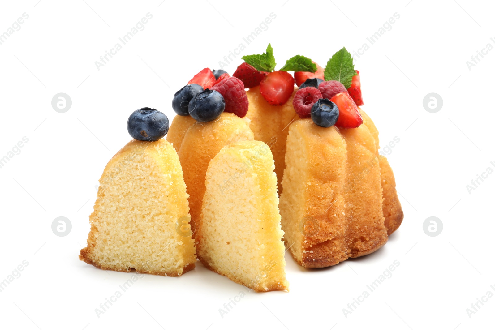 Tasty Bundt cake with berries and mint isolated on white Photo of Tasty Bundt cake with berries and mint isolated on white