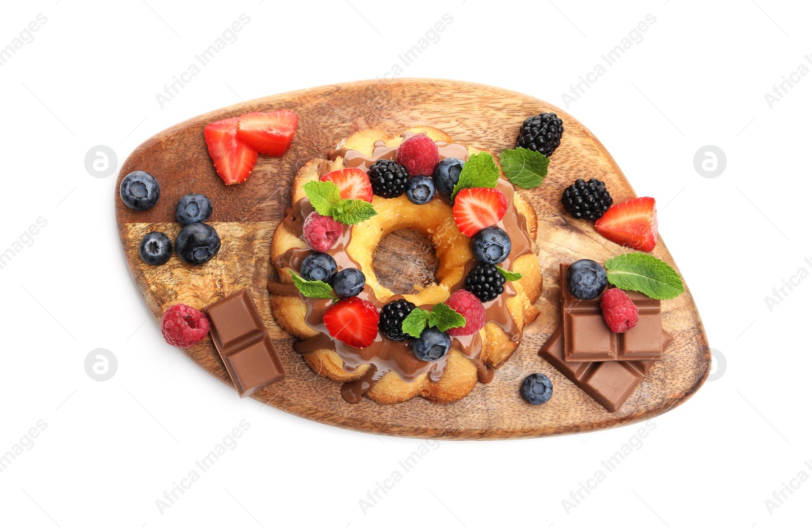 Tasty Bundt cake with berries, chocolate and mint isolated on white, top view Photo of Tasty Bundt cake with berries, chocolate and mint isolated on white, top view