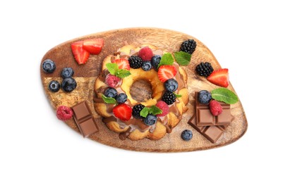 Photo of Tasty Bundt cake with berries, chocolate and mint isolated on white, top view
