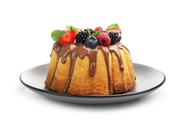Photo of Tasty Bundt cake with berries, chocolate and mint isolated on white
