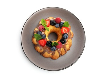 Photo of Tasty Bundt cake with berries, chocolate and mint isolated on white, top view