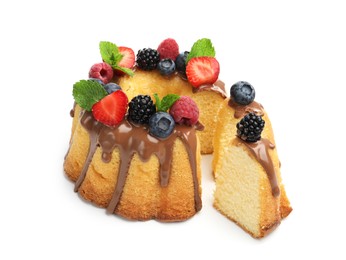 Photo of Tasty Bundt cake with berries, chocolate and mint isolated on white