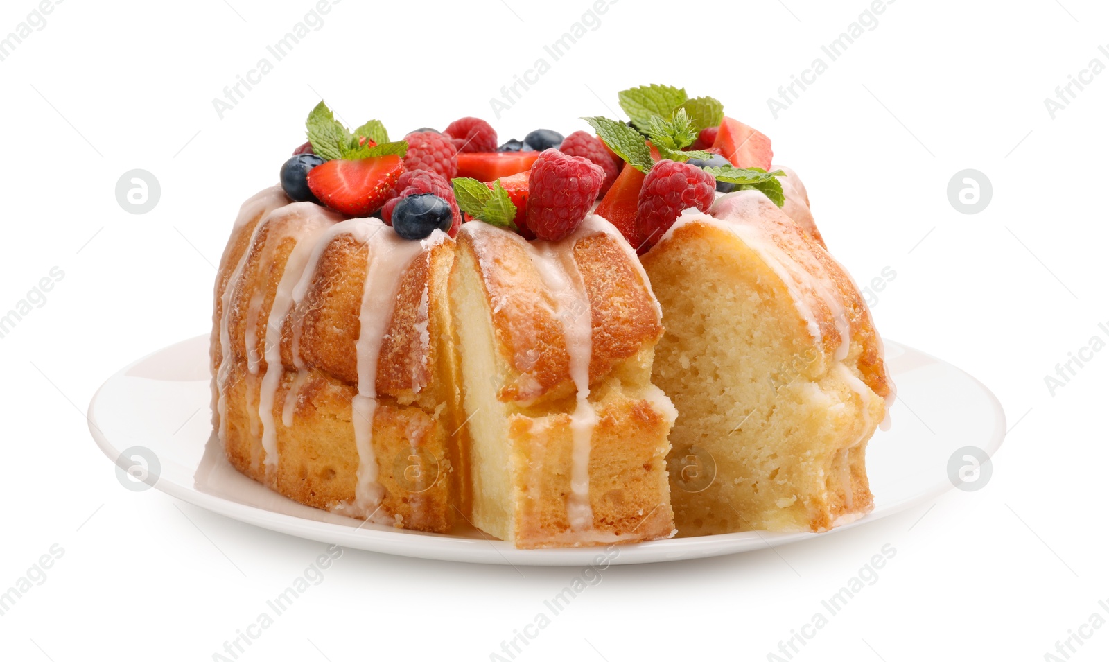 Delicious bundt cake with berries, glaze and mint isolated on white Photo of Delicious bundt cake with berries, glaze and mint isolated on white