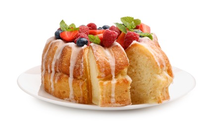 Photo of Delicious bundt cake with berries, glaze and mint isolated on white