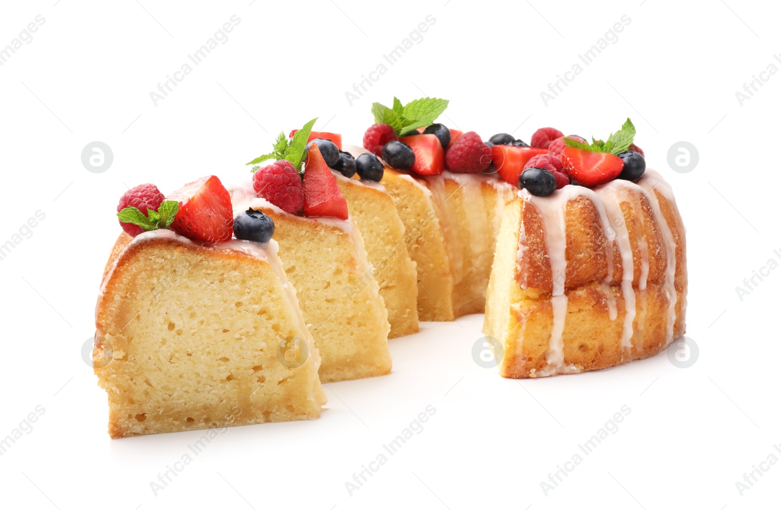 Pieces of delicious bundt cake with berries, glaze and mint isolated on white Photo of Pieces of delicious bundt cake with berries, glaze and mint isolated on white