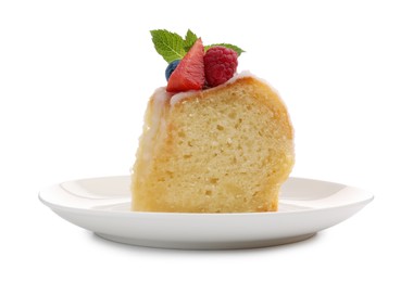 Photo of Piece of delicious bundt cake with berries, glaze and mint isolated on white