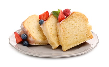 Photo of Pieces of delicious bundt cake with berries, glaze and mint isolated on white