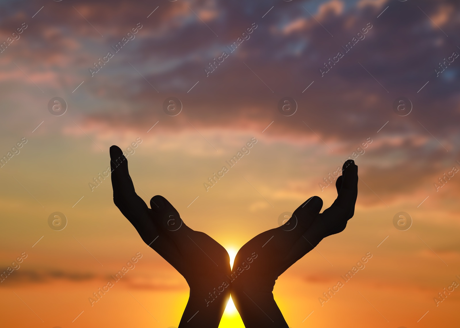 Hope. Woman holding hands against sky with clouds and sun, closeup Image of Hope. Woman holding hands against sky with clouds and sun, closeup