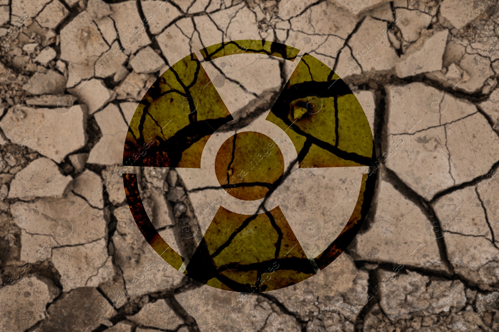 Radioactive sign on cracked dry earth, top view. Radiological pollution Image of Radioactive sign on cracked dry earth, top view. Radiological pollution