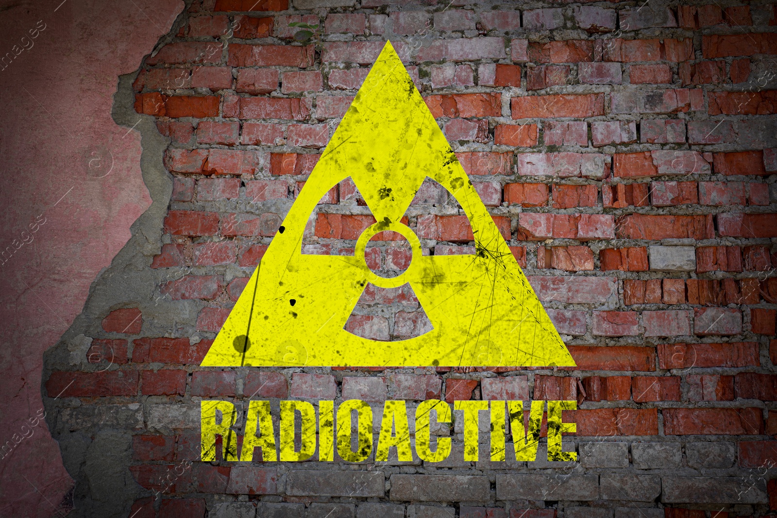 Yellow radioactive sign on old brick wall. Radiological pollution Image of Yellow radioactive sign on old brick wall. Radiological pollution