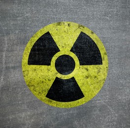 Image of Radioactive sign on grey textured surface. Radiological pollution