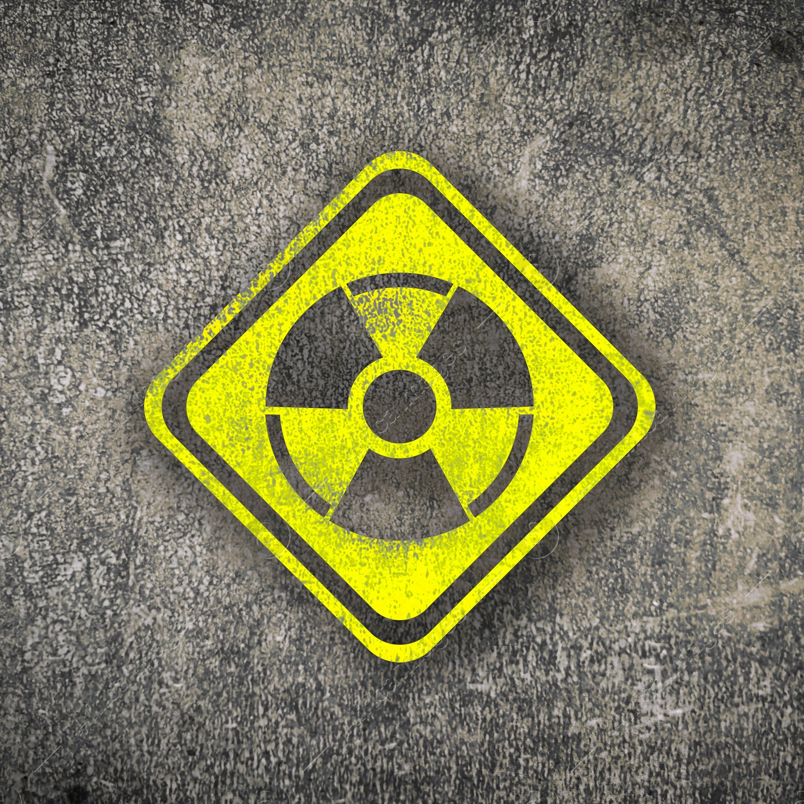 Radioactive sign on grey textured surface. Radiological pollution Image of Radioactive sign on grey textured surface. Radiological pollution