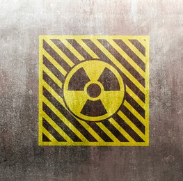 Image of Radioactive sign on grey textured surface. Radiological pollution