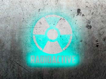 Image of Radioactive sign on grey textured surface. Radiological pollution