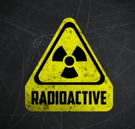 Image of Yellow radioactive sign on scratched black surface. Radiological pollution