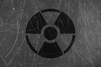 Image of Radioactive sign on scratched metal surface. Radiological pollution