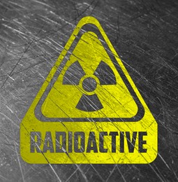 Image of Radioactive sign on scratched metal surface. Radiological pollution