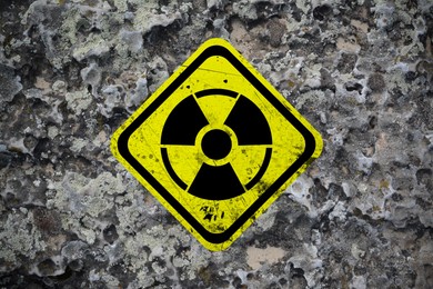 Image of Yellow radioactive sign on textured background. Radiological pollution