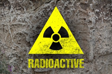 Image of Yellow radioactive sign on textured background. Radiological pollution